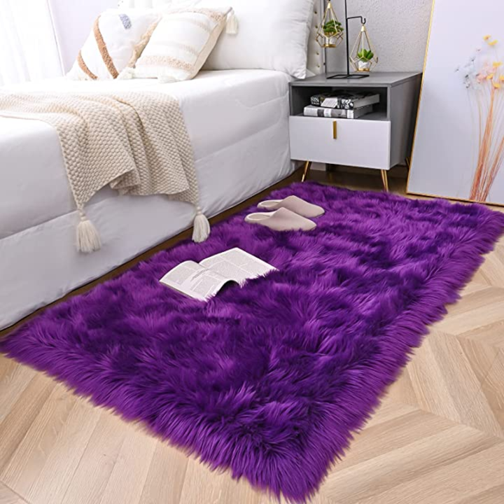Contemporary living room with a large rectangular faux sheepskin area rug