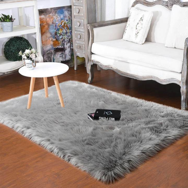 Texture swatch of a premium faux sheepskin rug, showcasing softness and quality