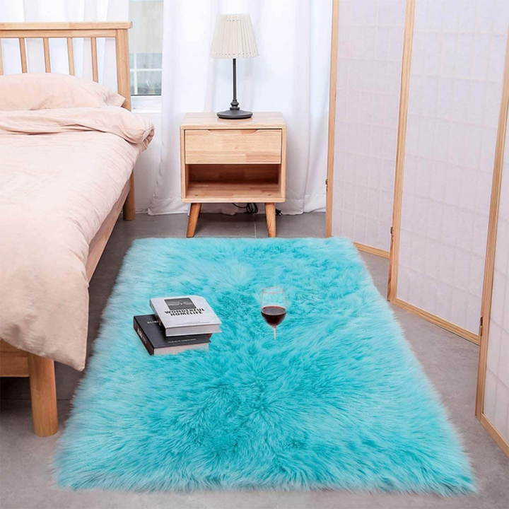 Faux sheepskin rug in a neutral tone, versatile for various home decor styles