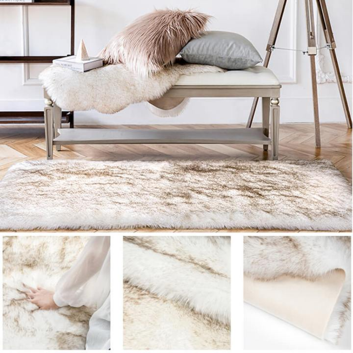 Rectangular faux sheepskin rug creating a soft zone in an open-plan living area