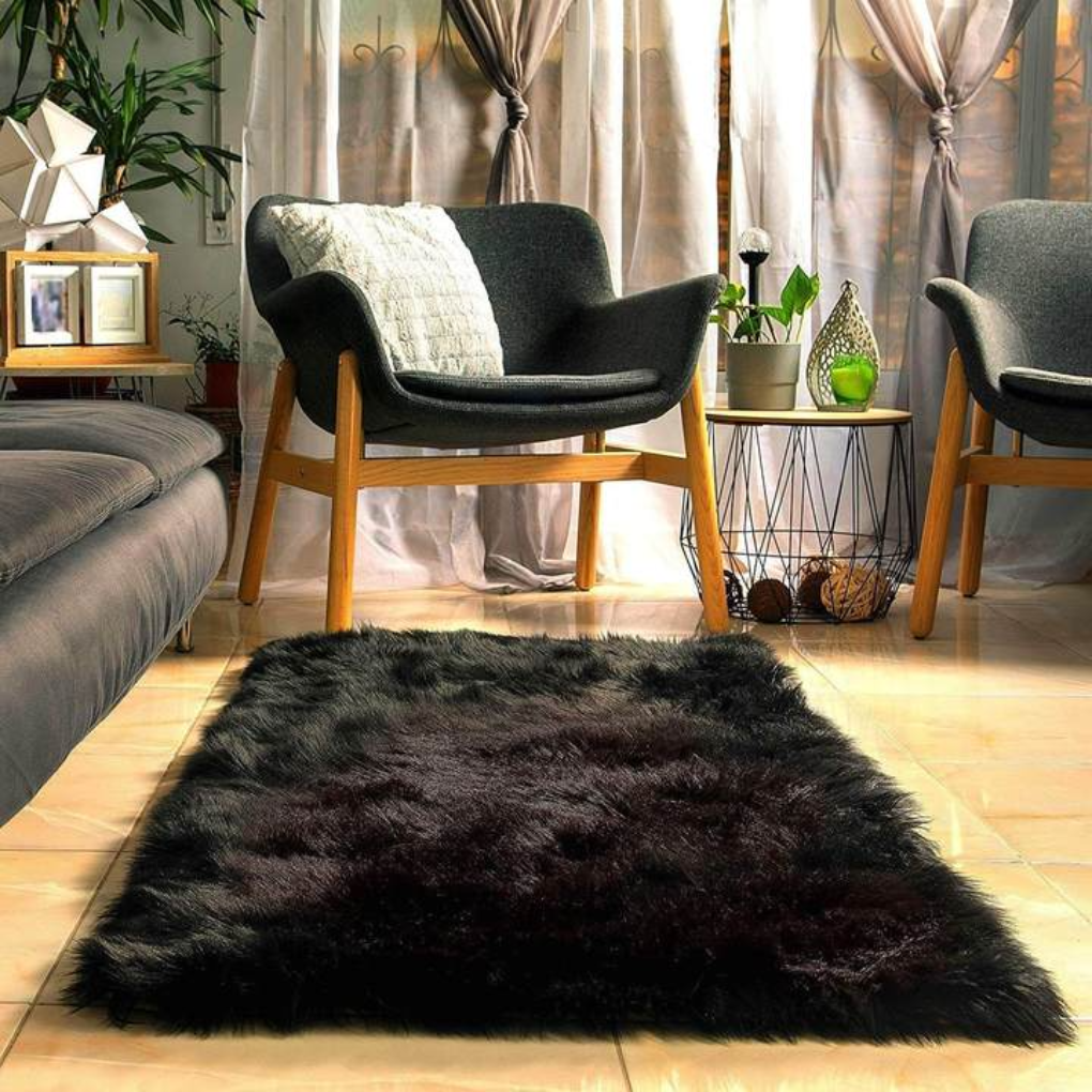A stack of various sizes of plush faux sheepskin rugs, ready for home styling
