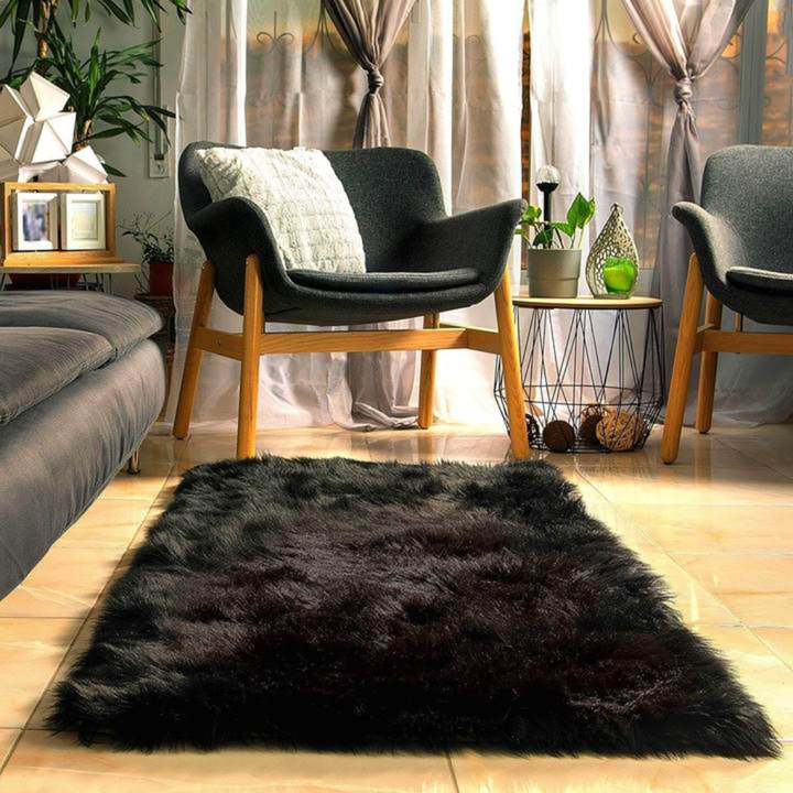 A stack of various sizes of plush faux sheepskin rugs, ready for home styling