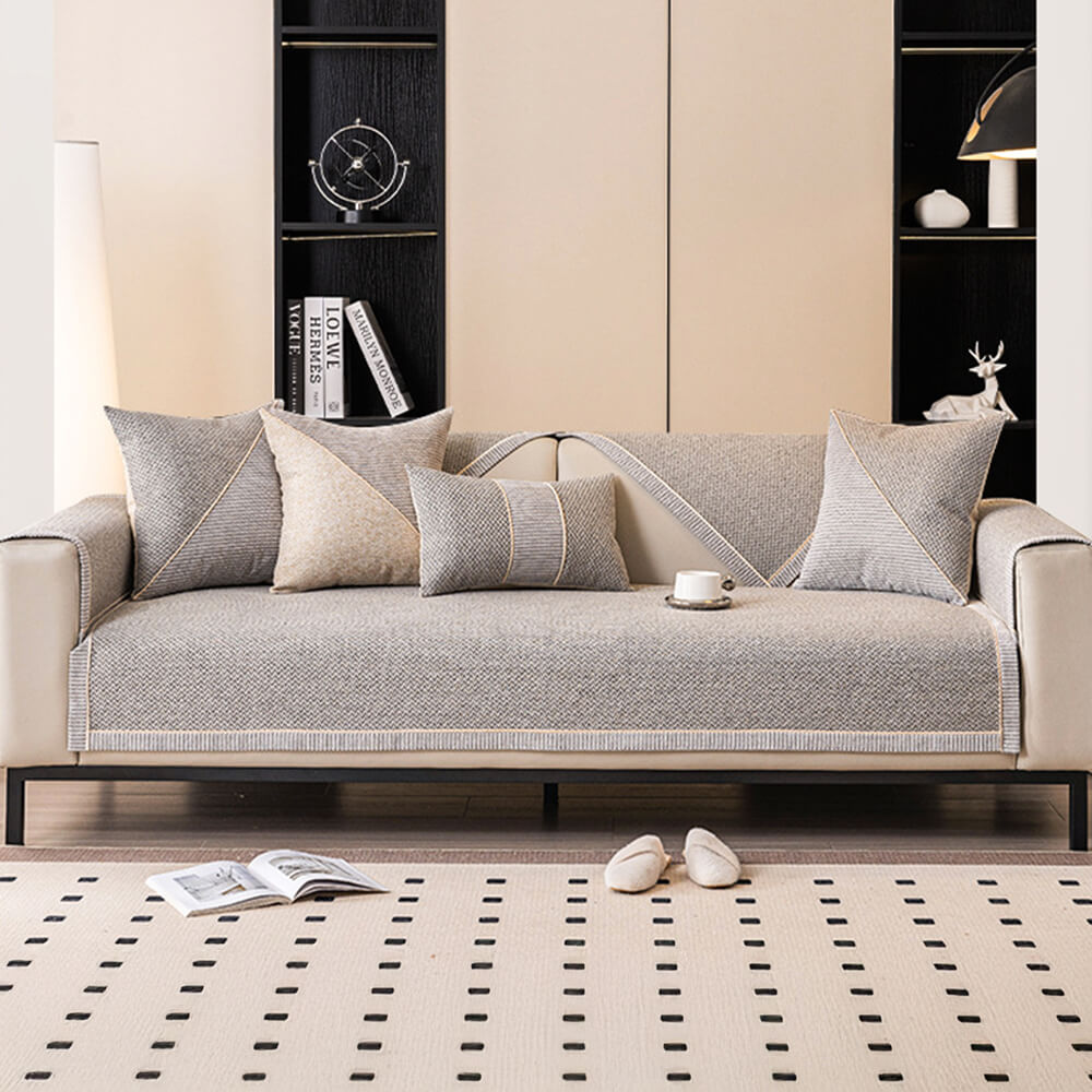 Light blue woven sofa cover with a 3D weave texture and non-slip backing.