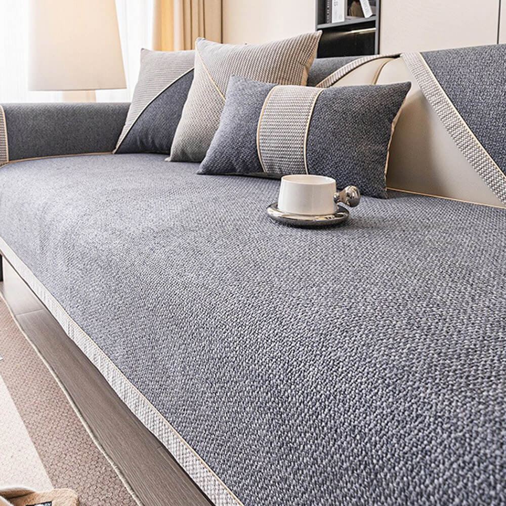 Black woven sofa cover with a modern design, featuring a non-slip backing for living room furniture.