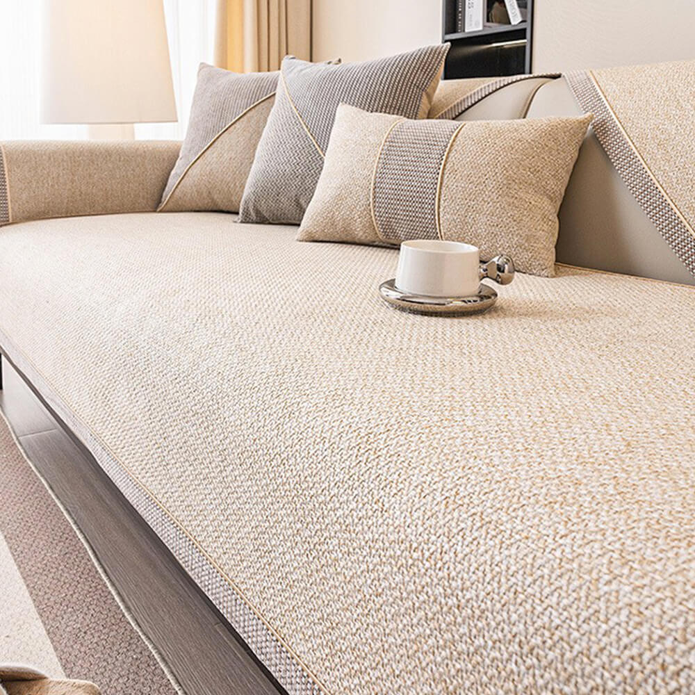 Purple woven sofa cover, pet-friendly and non-slip, enhancing home decor.