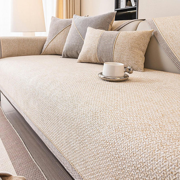 Purple woven sofa cover, pet-friendly and non-slip, enhancing home decor.