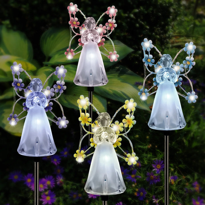 Solar Angel Garden Stake with white wings, glowing, perfect for outdoor lighting and memorial decor.