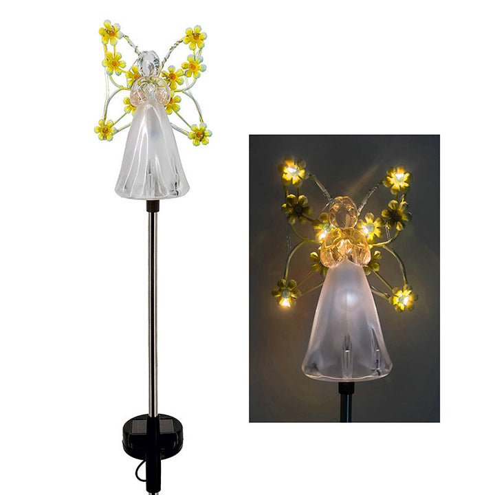 Weatherproof solar angel light illuminating a garden path, an attractive and functional outdoor lighting solution.