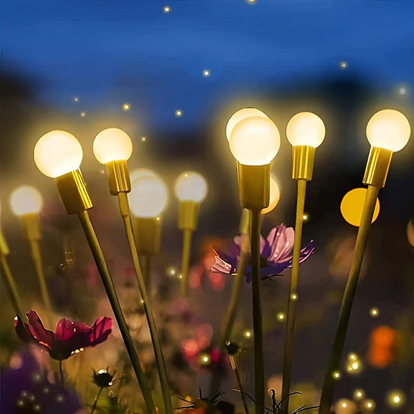 Detailed view of a single solar firefly light, showcasing its flexible design and outdoor durability.