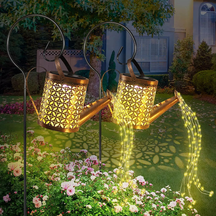 Metal solar watering can with LED fairy lights, a charming addition for lawn or patio decor.