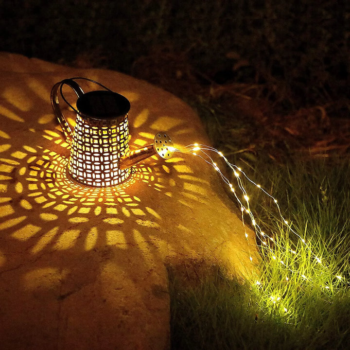 Decorative solar watering can with warm fairy lights, illuminates garden paths and outdoor spaces.