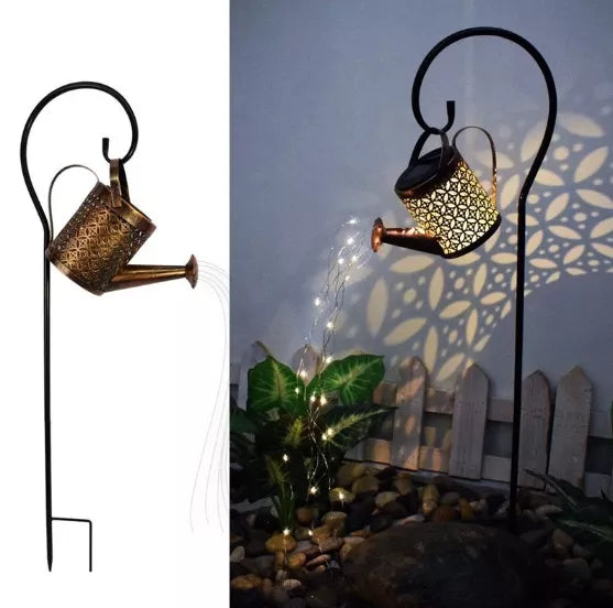 Gift-ready solar glowing watering can with delicate fairy lights, beautiful lawn and garden decor.