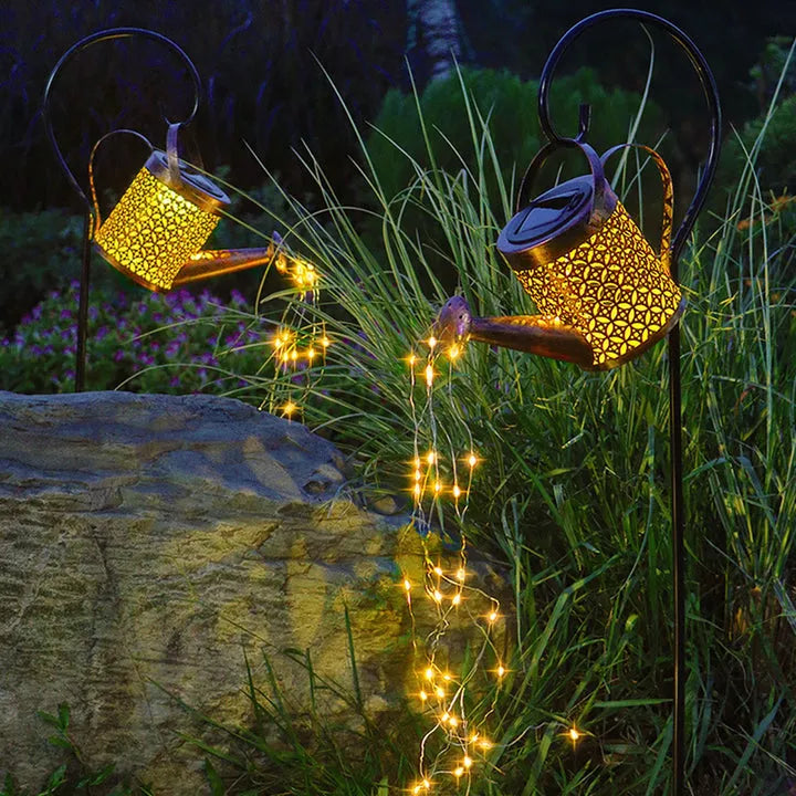 Patio lights: solar glowing watering can with twinkling fairy lights, stylish metal garden decor.