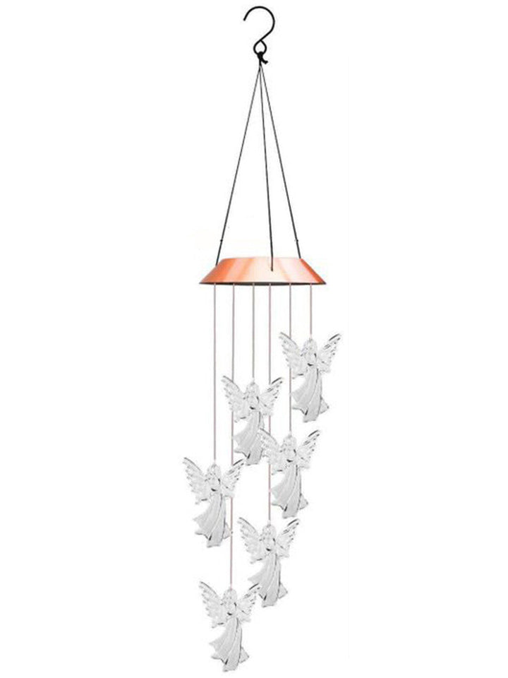 Close-up of solar angel wind chime, soft LED glow, waterproof outdoor lighting for home decor