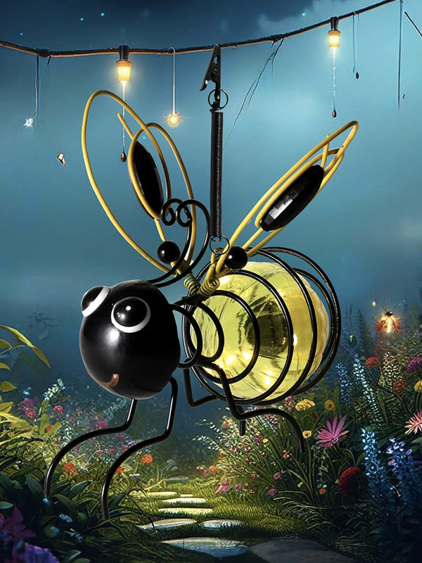 Solar-powered bee figurine light, perfect for outdoor garden and patio decoration at night.