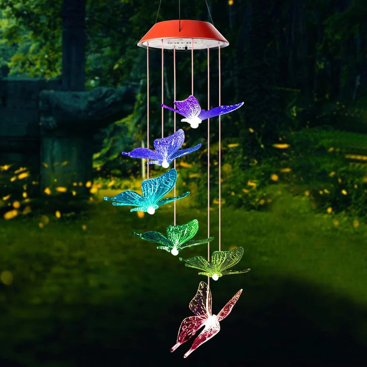 Decorative solar butterfly lights with a wind chimes, adding kinetic and visual appeal to a lawn.