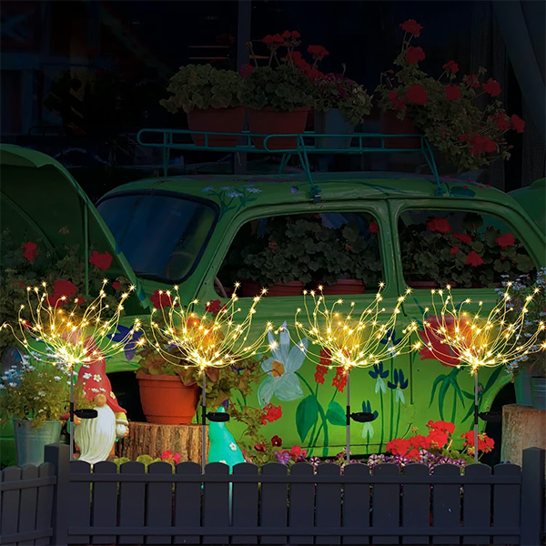 A single solar firework garden light standing tall, showcasing its bright LED illumination.