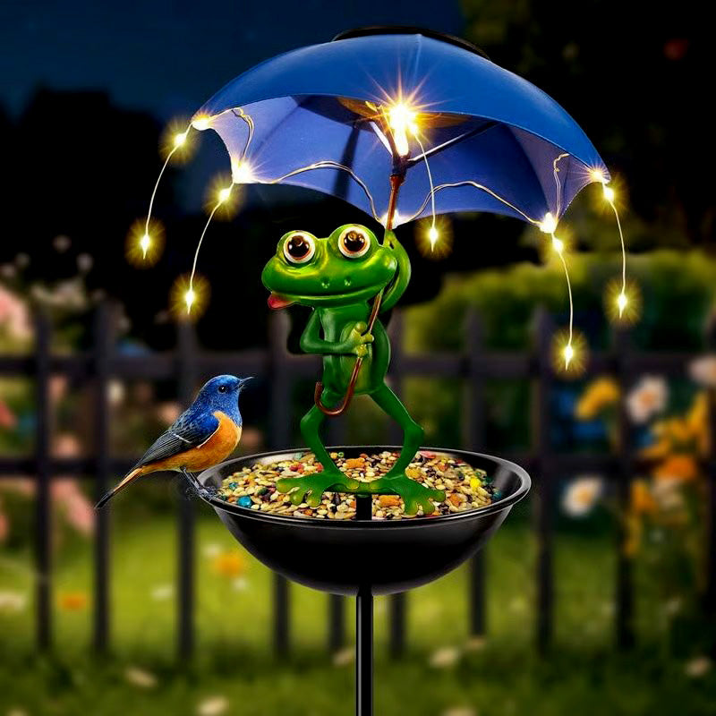 Solar powered LED animal garden stake bird feeder with bird cage, illuminating backyard