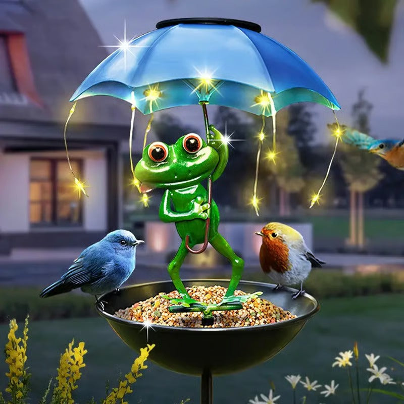 Functional and decorative solar powered LED bird feeder with a unique animal stake design