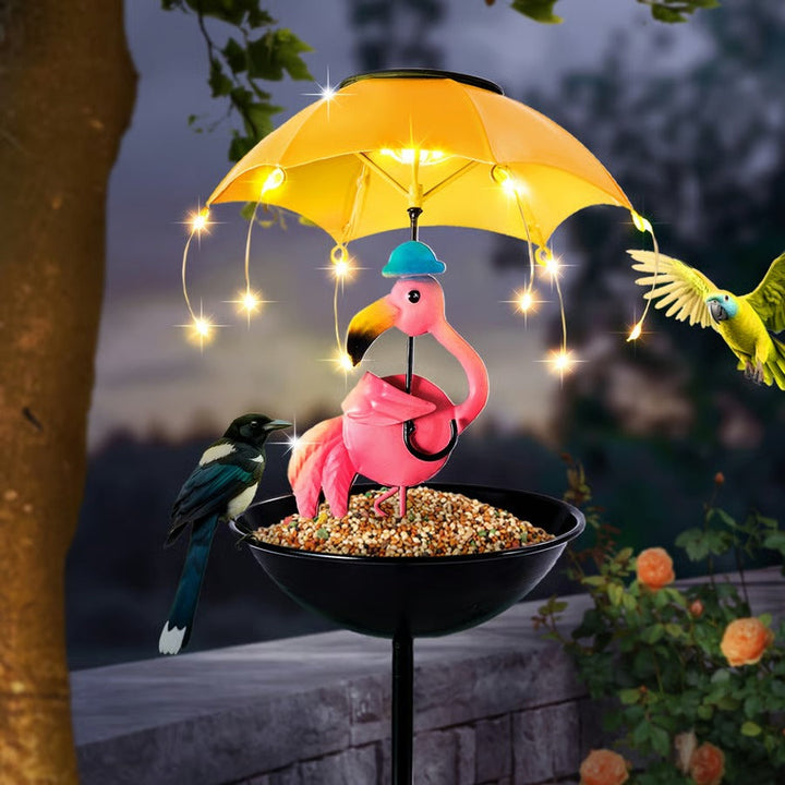 Bird feeder with solar panel and LED light, designed as a decorative animal garden stake