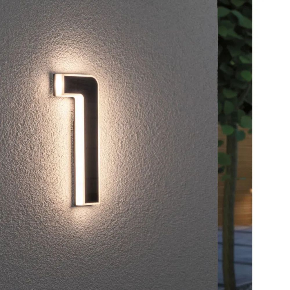 Illuminated address plaque with solar power, weather resistant for enhanced exterior visibility.