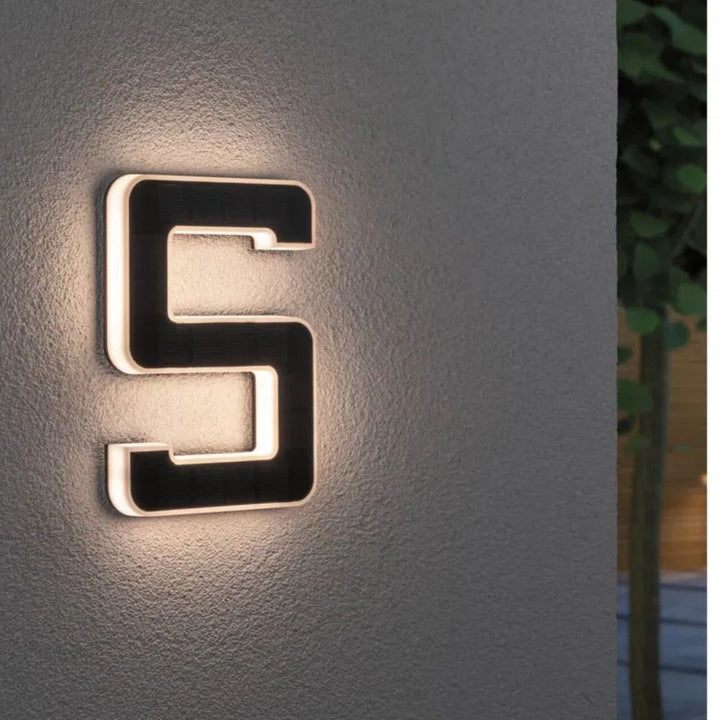 Sleek solar address plaque, LED illuminated for superior nighttime visibility on any home exterior.