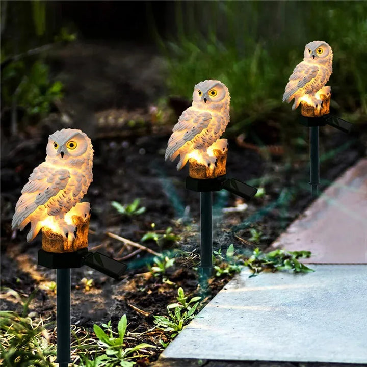 Eco-friendly solar owl garden light, designed with a stake for easy lawn and patio placement.