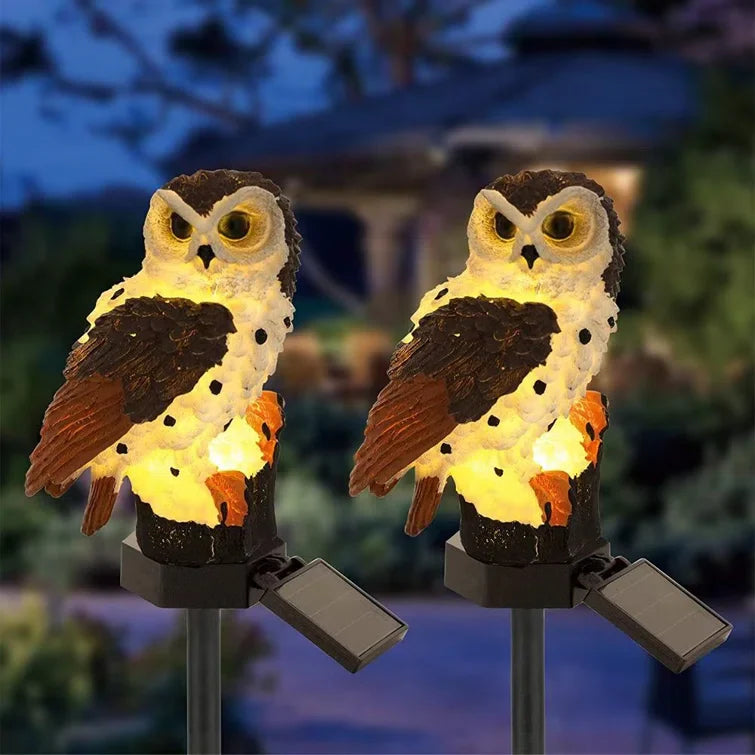Garden adornment: Solar owl LED light on a stake, perfect for outdoor and patio lighting.