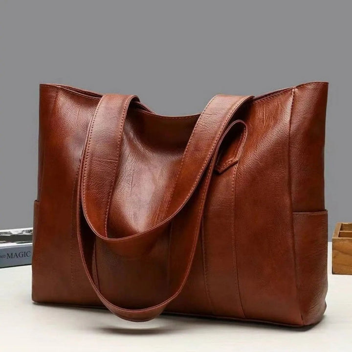 Black vintage women's shoulder tote bag, an elegant and practical everyday fashion accessory.