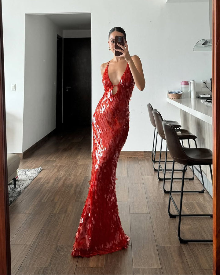 Sparkly women's homecoming maxi dress with a plunge neckline and sequin details, ideal for prom night.