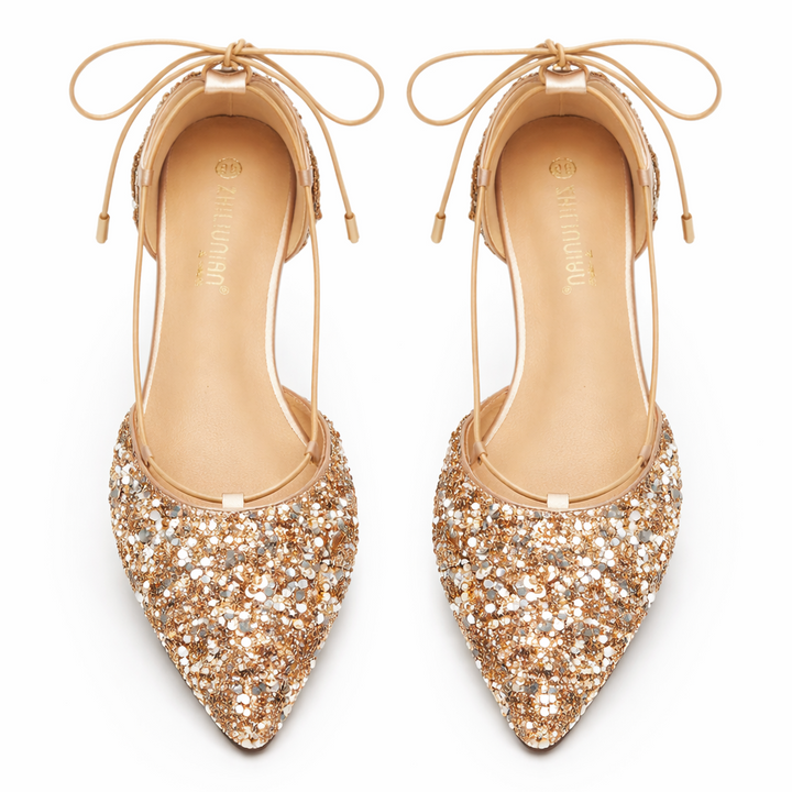 Elegant women's pointed toe glitter flats with adjustable ankle strap, perfect sparkly party footwear.