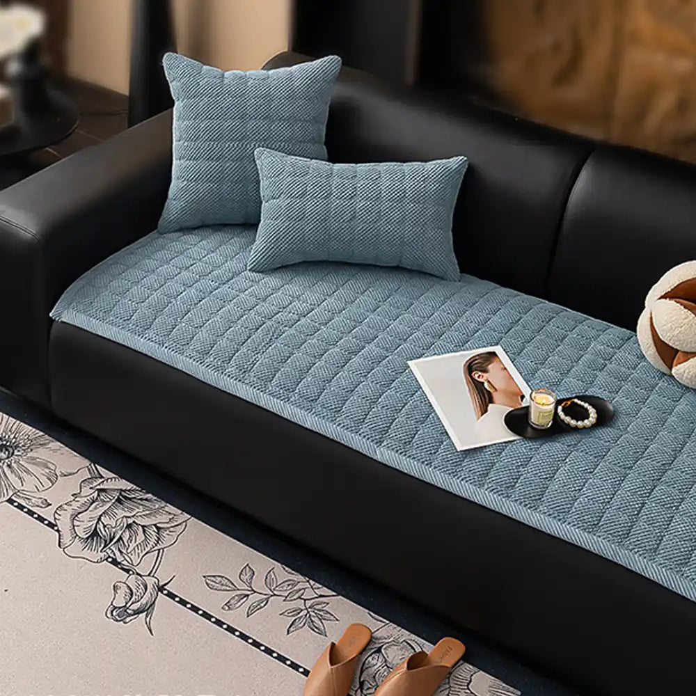 Blue square corduroy furniture protector, non-slip and machine washable for pet owners.