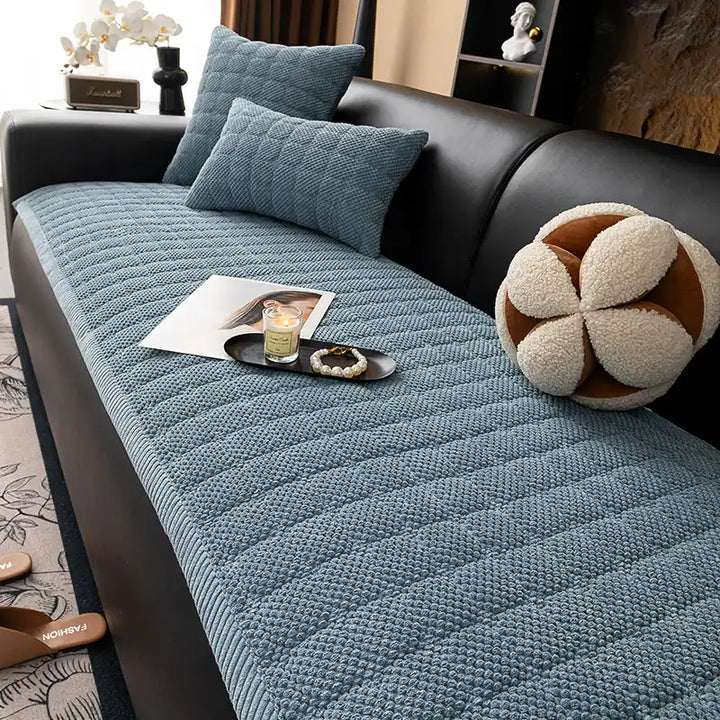 Stylish green corduroy square couch protector, non-slip base for pets and home decor.