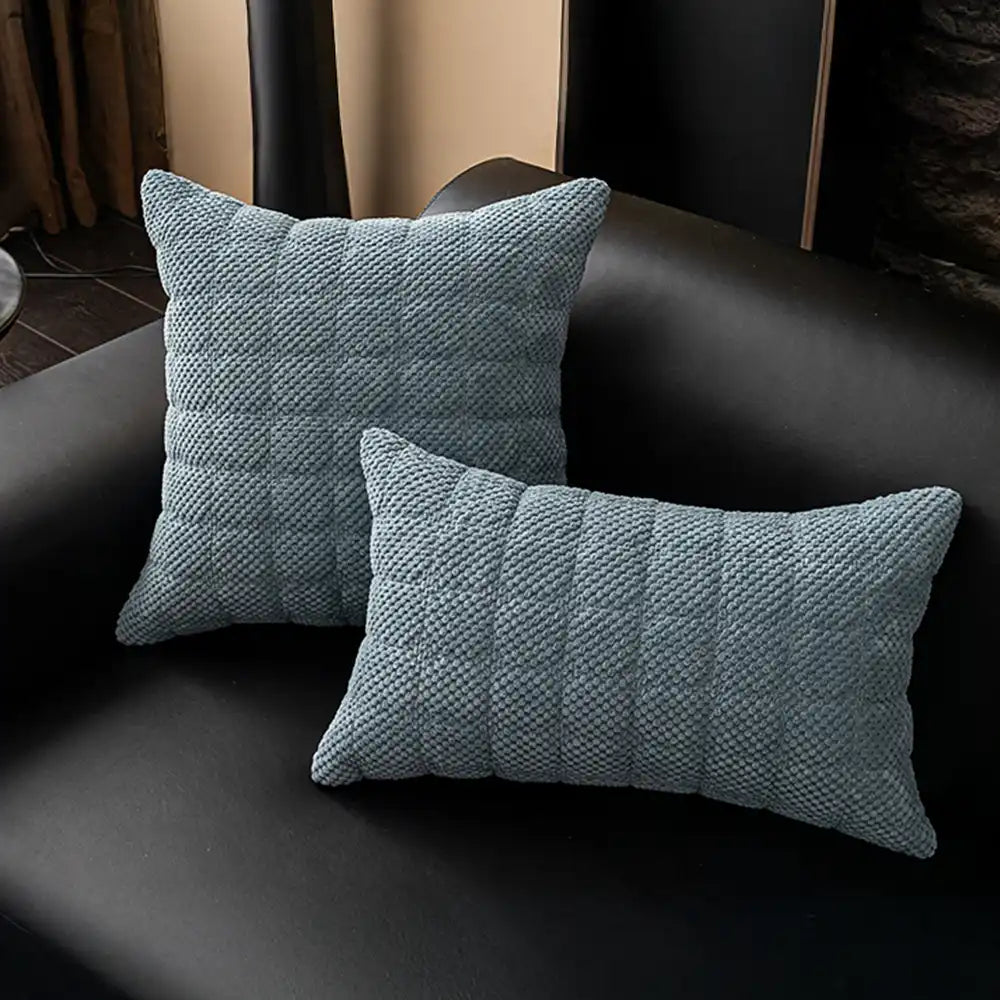 Packaging of a square corduroy pet-friendly non-slip couch cover, ready for use.