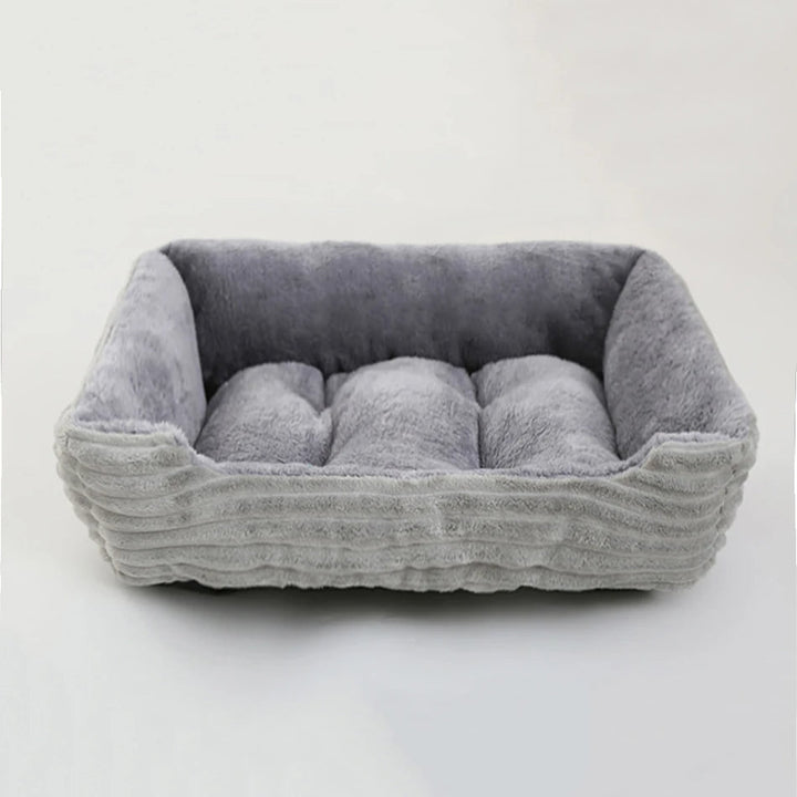 Small dog square calming bed, plush and cozy with a grey waterproof oxford fabric exterior