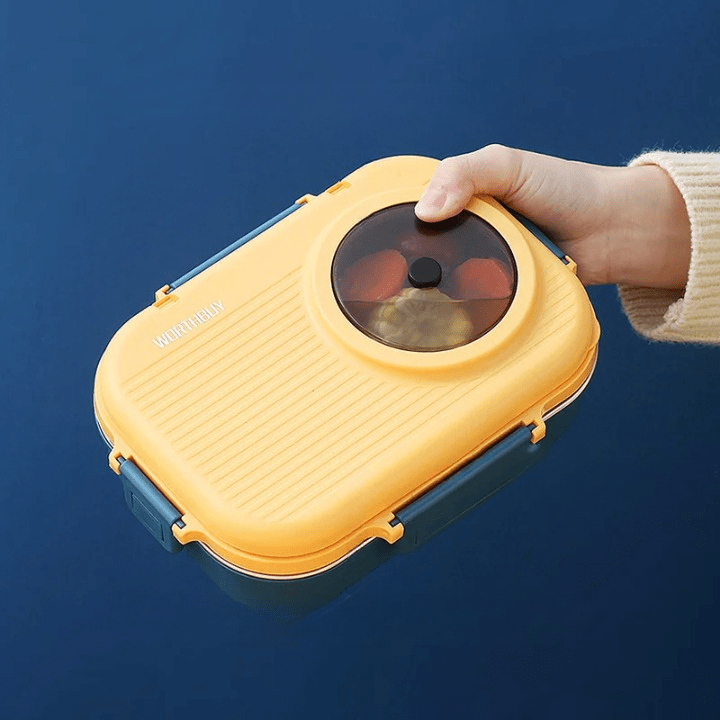 Adult holding a sleek stainless steel 3-compartment food container, great for work lunches & meal prep.