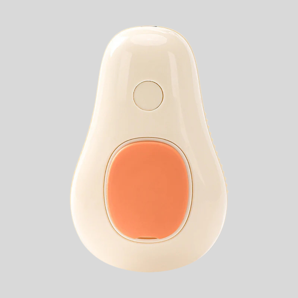Steaming pet grooming brush for gentle deshedding & massage on dogs & cats. USB rechargeable pet care tool.