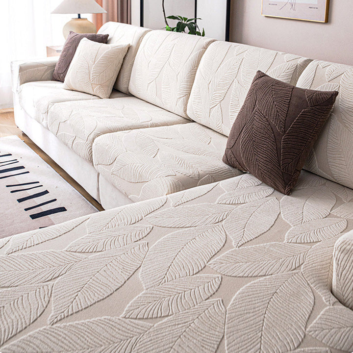 Universal jacquard sofa cover with an attractive leaf design, offering robust pet protection.