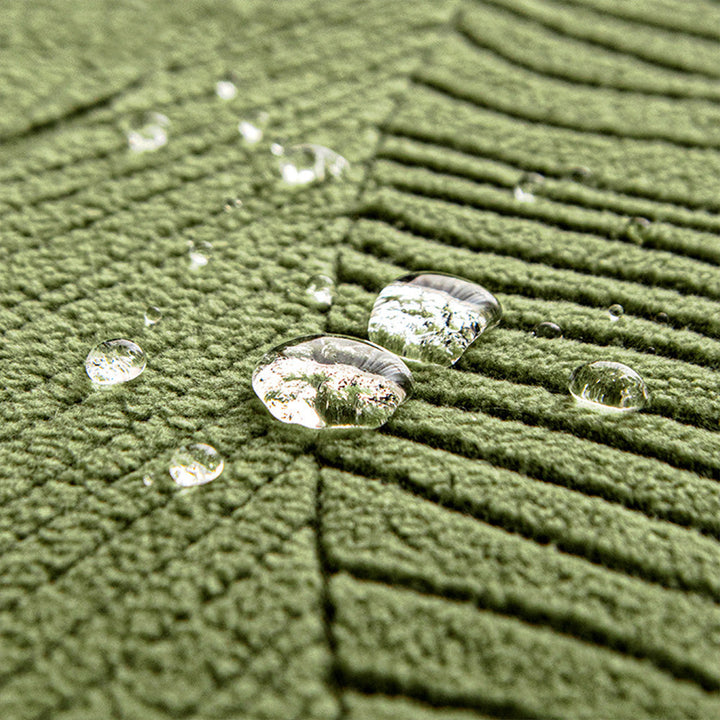 Close-up of jacquard leaf design on a durable, pet-friendly universal sofa cover.