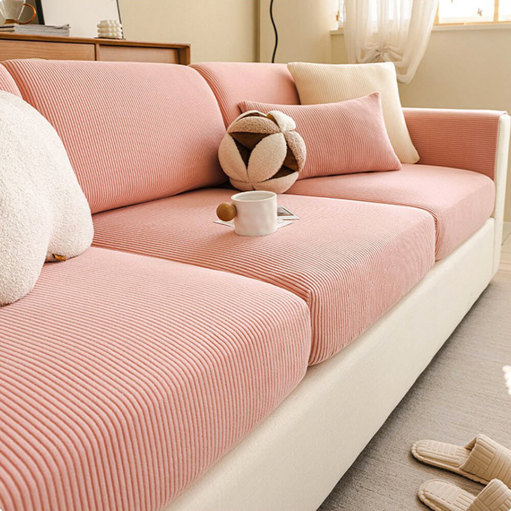 Comparison of a plain couch and one with a stripe corduroy stretch cover, showing transformation