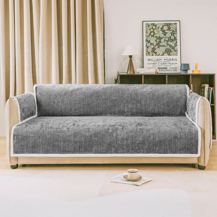 Full view of a striped pet sofa slipcover with armrest pockets, durable furniture protector for pets.