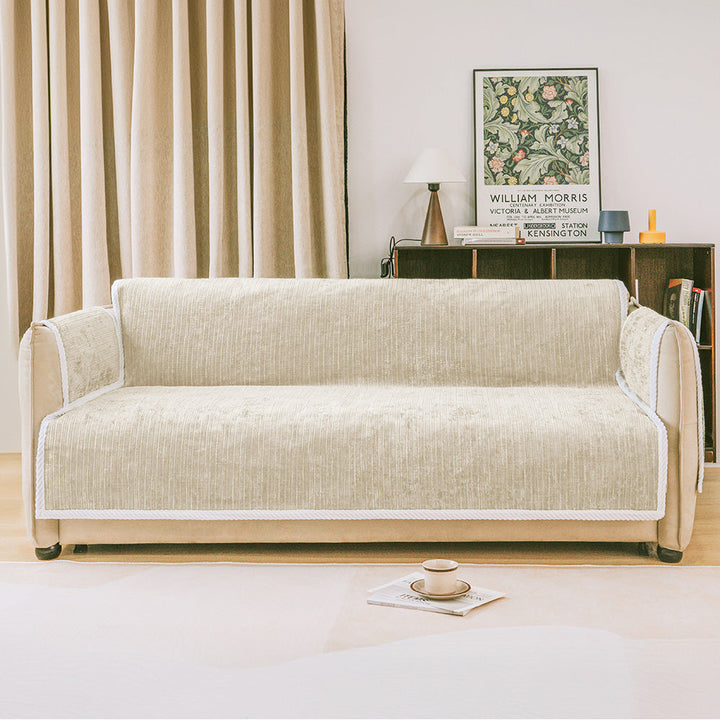 Striped pet couch cover on a sofa, showing full coverage and armrest protection; pet-friendly furniture.