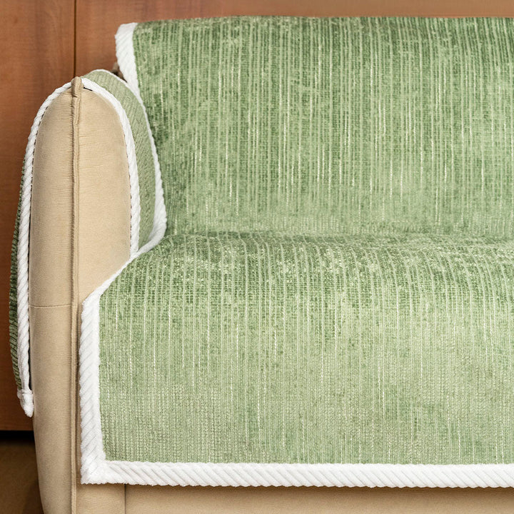 Overhead shot of a striped pet sofa slipcover, highlighting its universal fit and protective design.