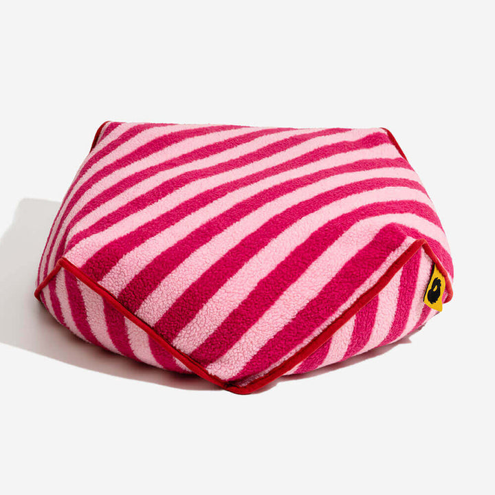 Striped polygonal calming dog bed, premium faux lambswool, essential pet comfort.