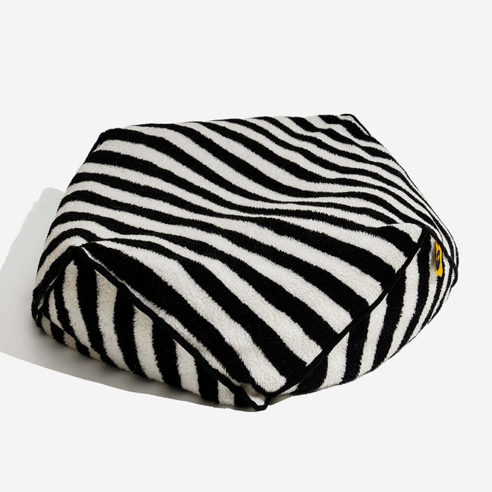 Durable striped pet bed with polygonal design, washable material for long-lasting use.