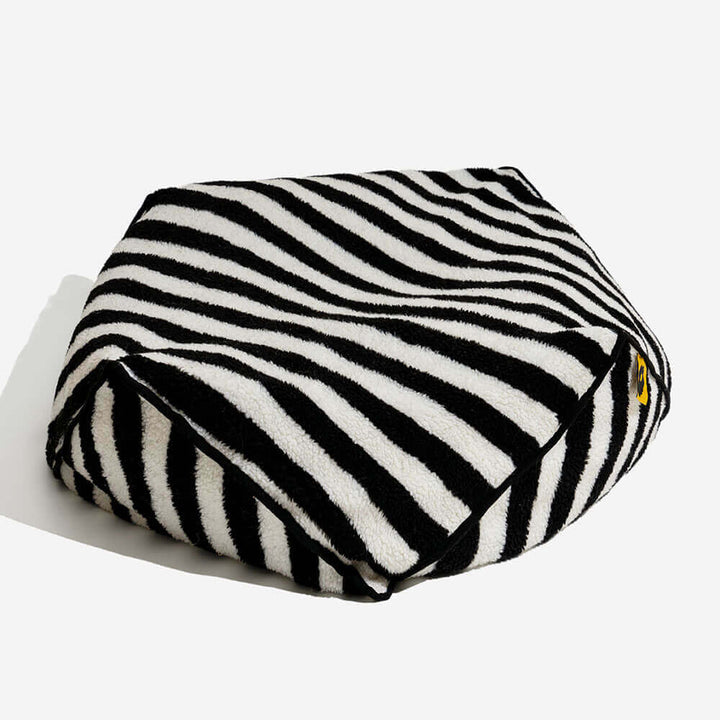 Durable striped pet bed with polygonal design, washable material for long-lasting use.