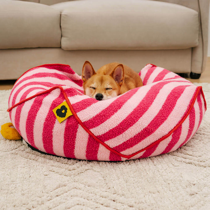 Geometric striped calming dog bed, washable faux lambswool for ultimate pet relaxation.