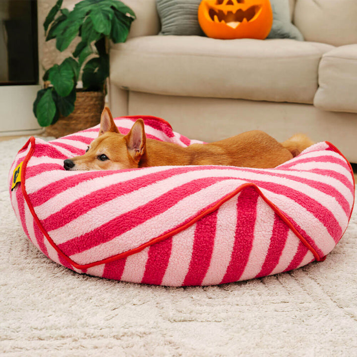 Faux lambswool striped dog bed, polygonal design, therapeutic calming pet comfort.