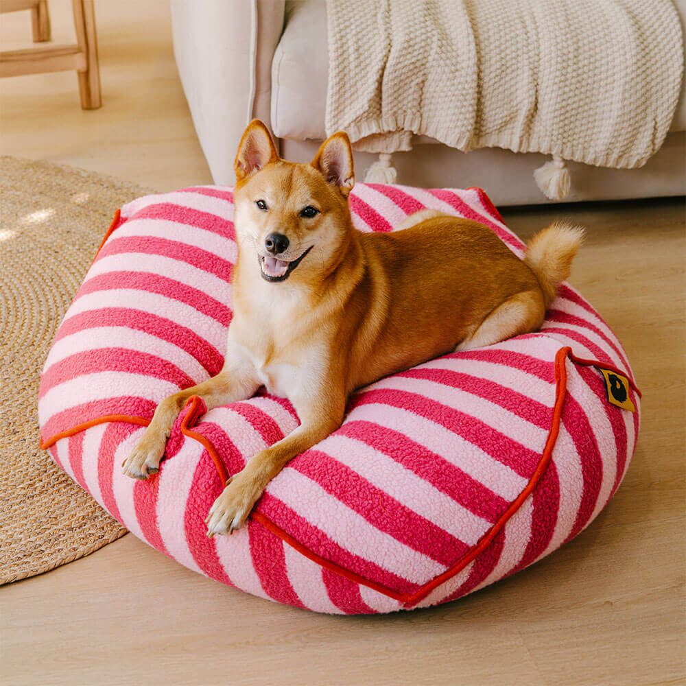 Stylish striped calming pet bed, washable and durable faux lambswool for dogs.