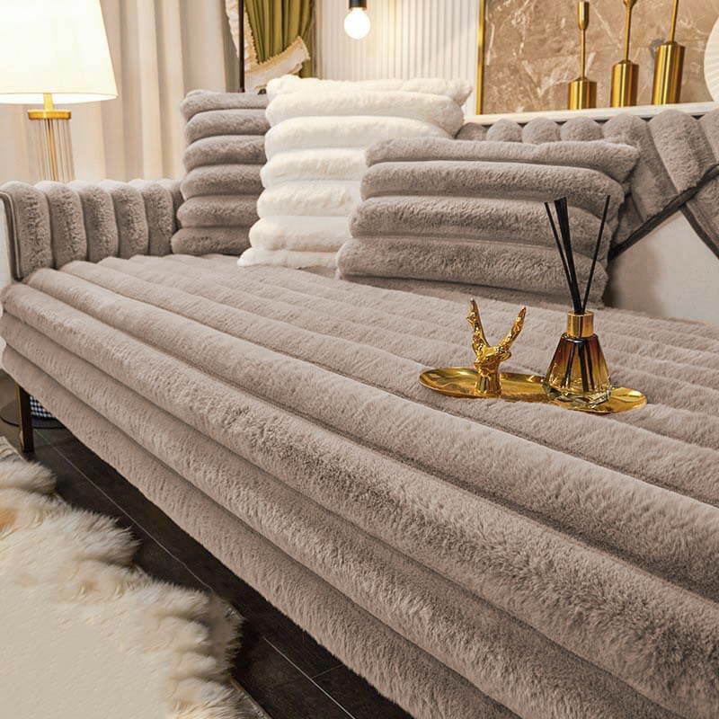 Close-up of striped plush fabric on a couch cover, showcasing its soft and thickened texture.